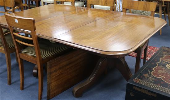 An extending dining table, W.127cm